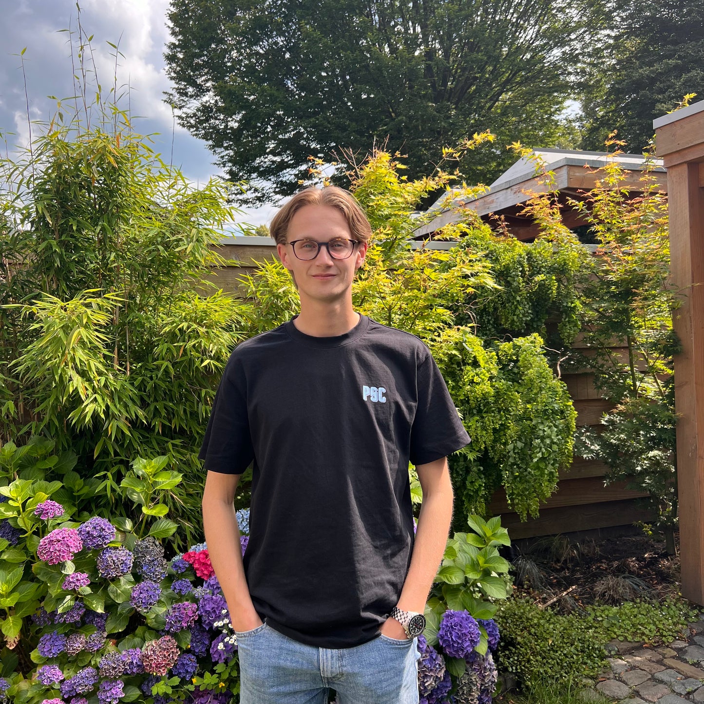 T-shirt 'Deliver' Zwart